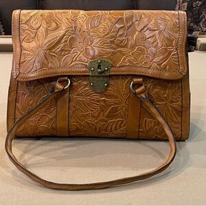 Patricia Nash ladies tooled bag caramel in color with dust bag price is firm